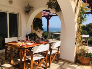 Our terrace under  the arches for nice outdoor eating is sheltered but with views!