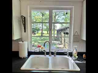 Kitchen with view of backyard