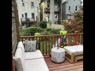 Back deck with grill, firepit, seating and outdoor dining table.