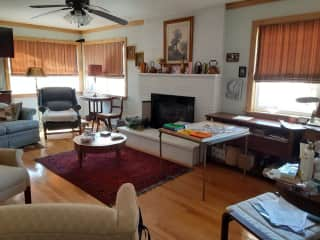 Living room with fireplace and television F