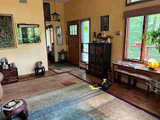 Front door of living room. View of front yard.