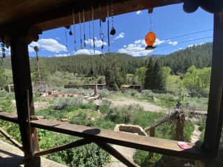 view from front porch. there is a river across the street and we see all kinds of wildlife in the meadow.  wild turkeys, mule deer, elk,