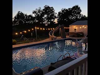 Relax on back porch overlooking pool