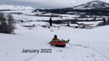 Sledding behind house