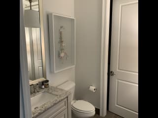 Guest half-bath leads to laundry room (and kitty’s area).