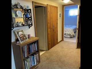 Downstairs hallway to bathroom and bedroom.