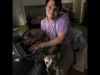 Adam working from home with Cookie on his lap