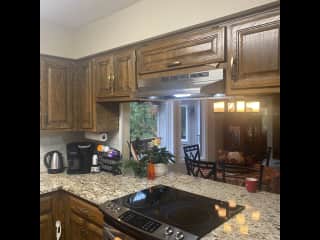 Kitchen that looks over to dinning room and living room.  You can be with everyone when you are cooking.
Window over sink so you can watch the birds at the bird feeder.