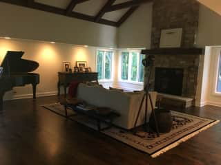 Grand piano and large, gas fireplace