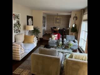 Living room and dining area.  The dogs love to sit in the living room and watch the traffic!  This is southern exposure so lots of sunshine in this room!  Great napping area