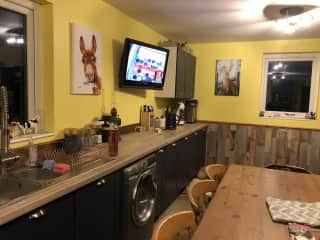 The Kitchen is a beautiful long farm kitchen. We have an 8 seat farmhouse table.