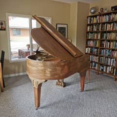 Baby grand piano in the family room on the lower level.