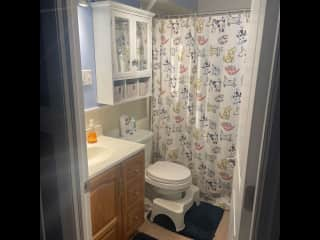 Hallway bathroom with tub for 2 bedrooms with bunk beds (not shown).