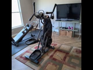 Bedroom that has been converted to workout room. There is a Total Body Machine, model# 11000 and a Bowflex M5