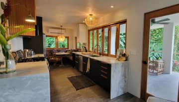 A large, fully stocked kitchen with propane-powered gas stove.