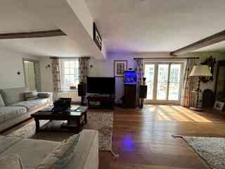 The lounge looking out towards the conservatory and garden.