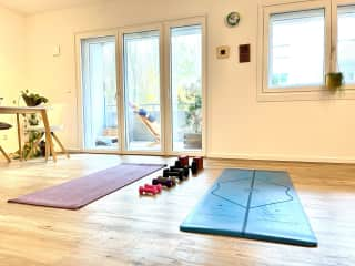 Open living/dining room can accommodate a workout setup for two.