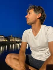Cédric waiting for the fireworks show along the river in Florence, Italy