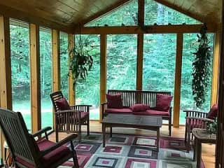 Indoor/outdoor screened porch.