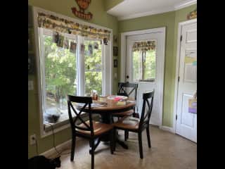 Eat in area in kitchen with a bay window.