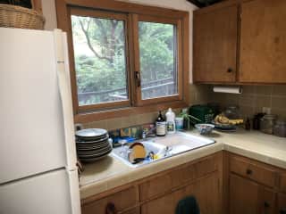Kitchen looks out onto entry deck