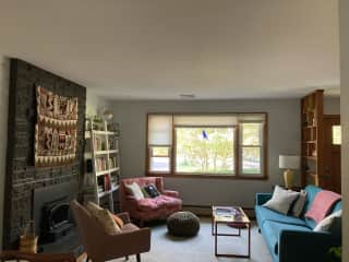 Living room w/ wood burning fireplace