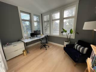 Office downstairs with standing desk Herman Miller Chair and 27" monitor