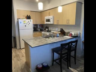 Kitchen provides ample room to cook! And we have an oven, stove-top, fridge, freezer, microwave, assortment of plates, utensils and cooking supplies for your convience. As well as a Keurig coffee machine, French-Press and Kettle!