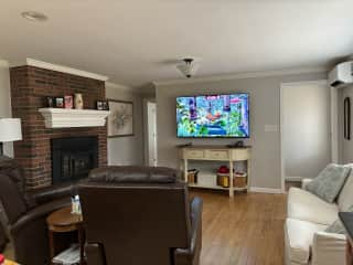 Sitting/TV area open to the kitchen. New 60” Sony 4G Smart TV with built in sound bar has online Netflix. Dash will cozy up to you in the recliner every night.