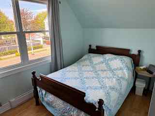 Upstairs bedroom #1 containing a double bed.