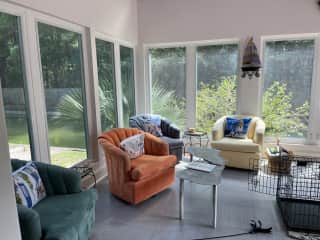 Sunroom overlooking canal. Totally tranquil.  There's a crate where Higgins and Pinot are trained to go for treats -- which is sometimes "jail" if they won't let me cook in the kitchen.