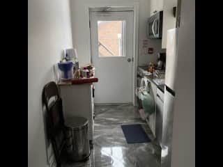 Kitchen is small but all new appliances. That's the back door leading to fire escape, and one floor down to the ground.