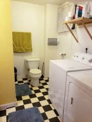 Guest basement in the bathroom, with a shower, and a washer and dryer