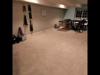 Full finished basement with some basic work out equipment and a T.V. to watch while working out.