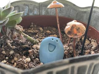 We have many whimsical friends tucked in corners of the house. This little guy lives on the windowsill at the kitchen sink.