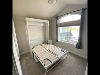 This is the room our sitters will use during their stay. There is a guest bathroom just outside this room. The bed has a brand new mattress.