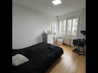 Bedroom with dressing table and a spacious dresser on the right side of the room