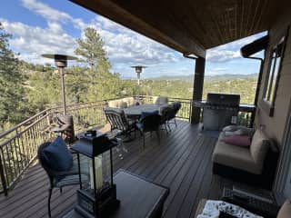 Deck (off main level) with sitting area, table, and grill.