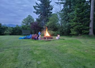 Back yard fire pit and trampoline.