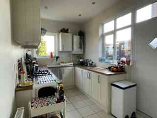 Small but well-equipped kitchen with a gas hob, electric oven, toaster and coffee machine