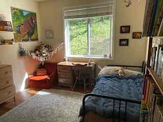 Bedroom #1
(Our daughter's room)
The twin bed opens up into a king sized bed. The work space has a great view of the oak covered hillside.