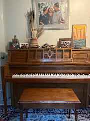 Upright piano (yes, it's tuned!) in the foyer