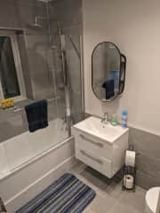 Upstairs bathroom with shower over bath.