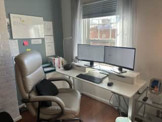 Here’s a close-up photo of the WFH area. You can plug your laptop into the dual monitors.