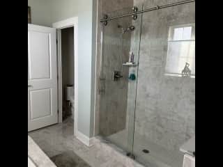 Large shower across from tub. Water closet. Two separate sinks.