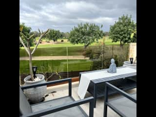 Terrace overlooks pool, garden and golf course