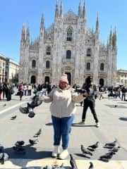 Feeding the pigeons at the Duomo di Milano