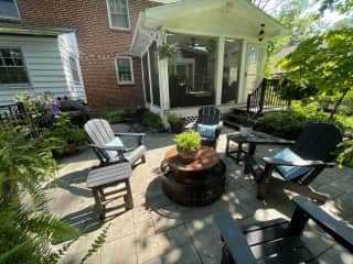 Outdoor patio with Weber gas grill, Adirondack chairs and solo fire pit. Firewood provided.