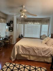 Guest bedroom with large flatscreen TV and Streaming