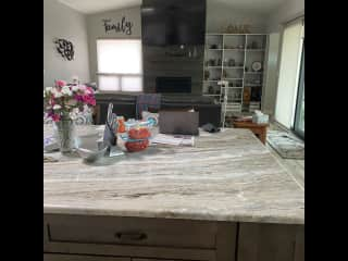 Looking from the kitchen to the great room and tv.